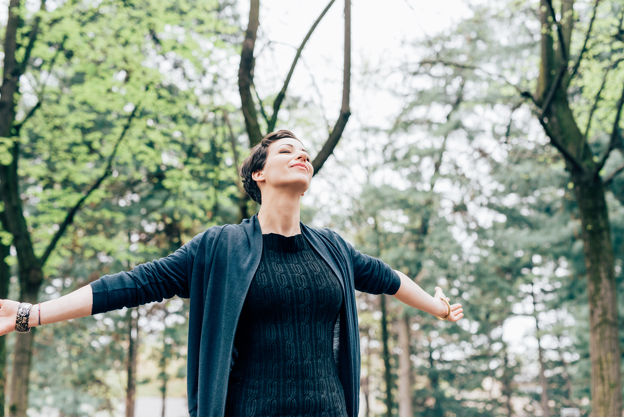 Woman Outside With Arms Outstretched Feeling Free
